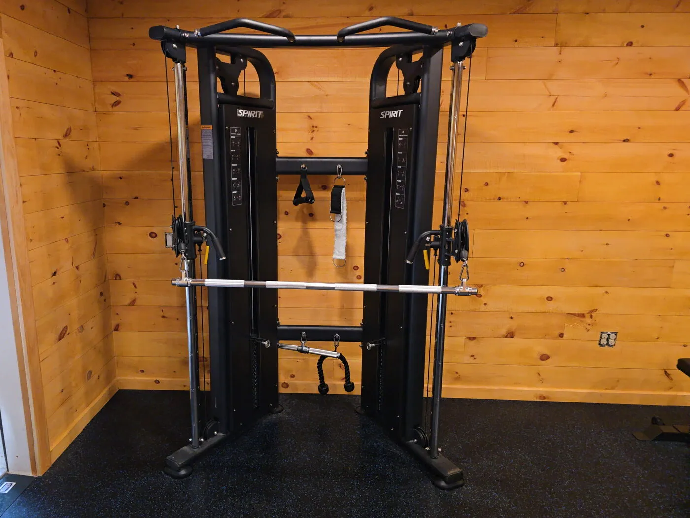 Spirit functional trainer standing on rubber gym flooring in a home gym