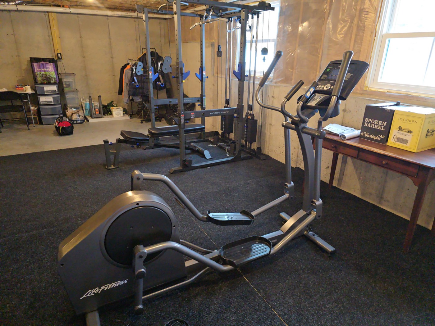 Life Fitness elliptical installed in a finished basement